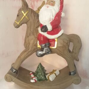 Babbo Natale su cavallo a dondolo